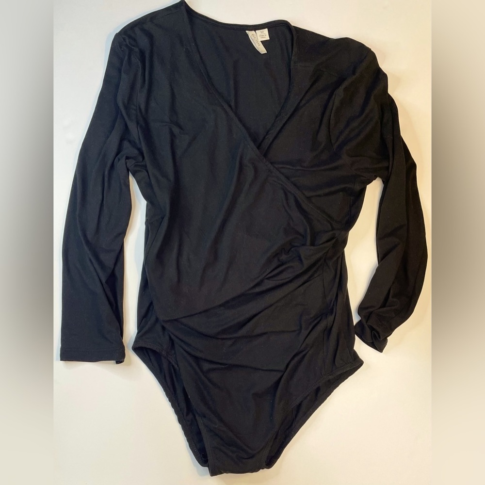 Black bodysuit, crossover bust. Cute alone or under something.